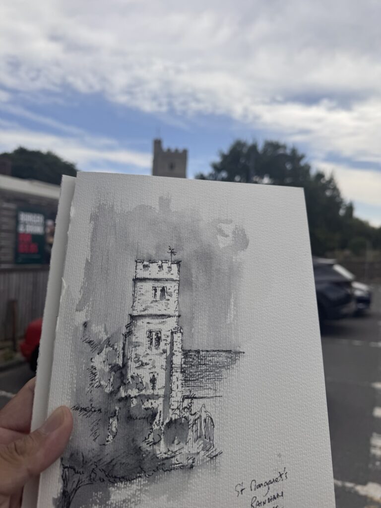 Finished ink-and-wash painting of St Margaret’s Church tower held against the church in the distance.