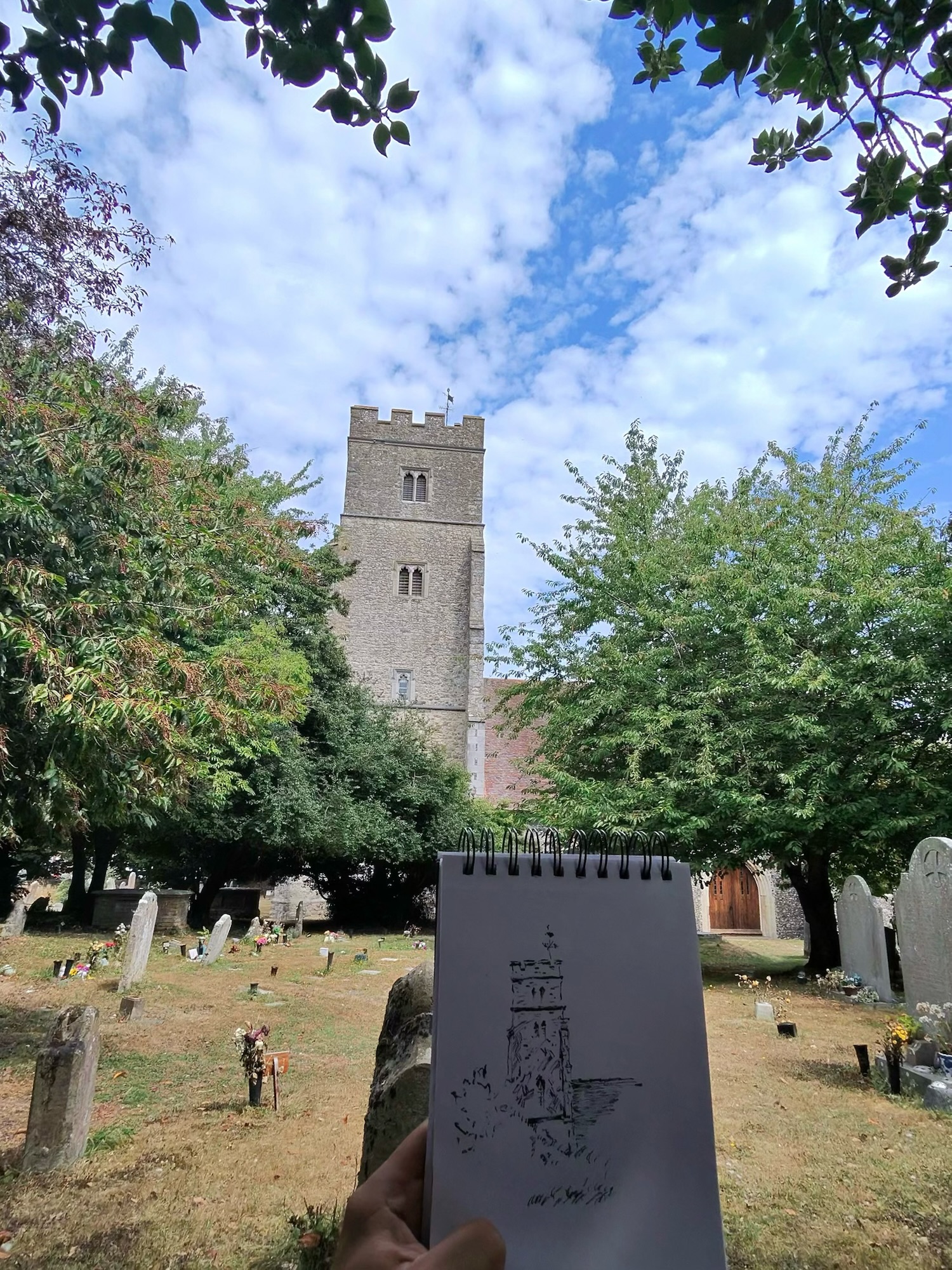 Sketching St Margaret’s Church in Rainham with My Little Girl 2 Small ink sketch of St Margaret’s Church tower held up in front of the churchyard.
